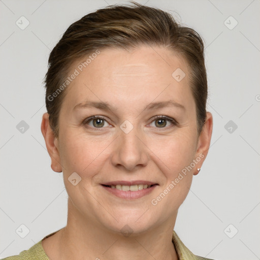 Joyful white young-adult female with short  brown hair and grey eyes