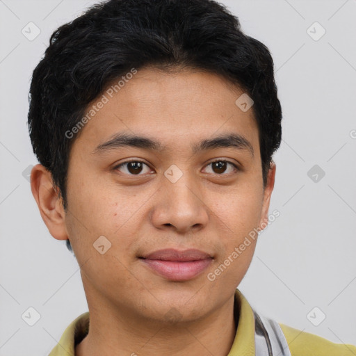 Joyful latino young-adult male with short  brown hair and brown eyes