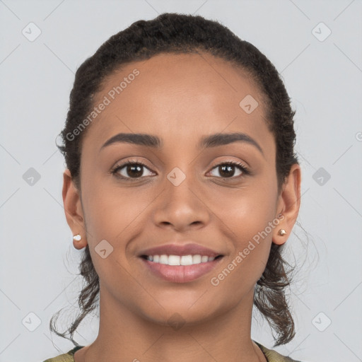 Joyful latino young-adult female with short  brown hair and brown eyes