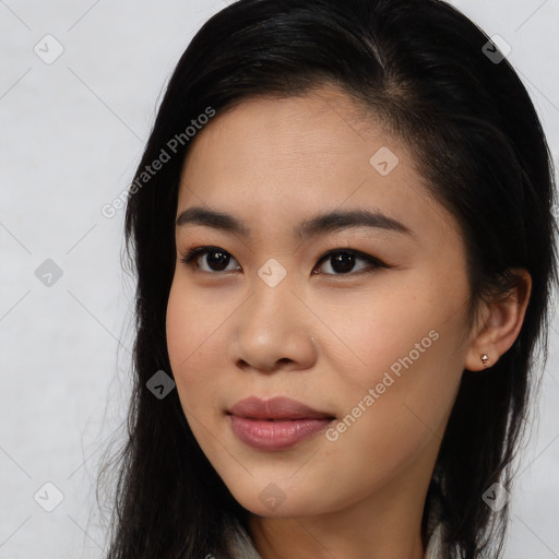 Joyful asian young-adult female with long  brown hair and brown eyes