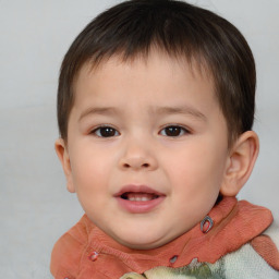 Joyful white child male with short  brown hair and brown eyes