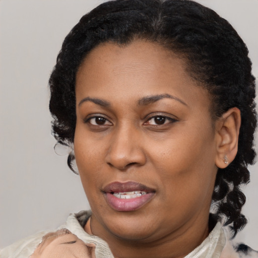 Joyful latino adult female with short  brown hair and brown eyes