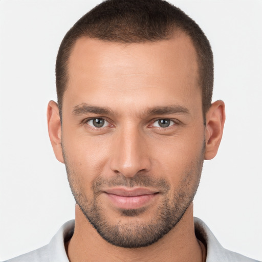 Joyful white young-adult male with short  brown hair and brown eyes