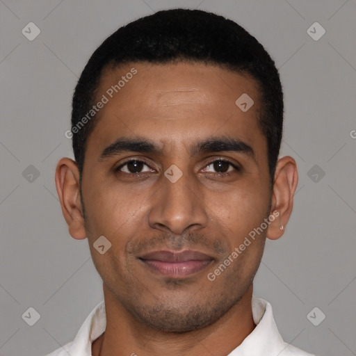 Joyful latino young-adult male with short  black hair and brown eyes