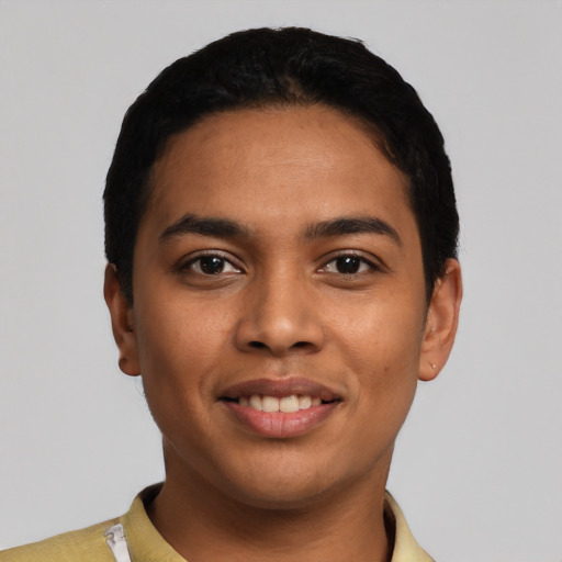 Joyful latino young-adult male with short  black hair and brown eyes