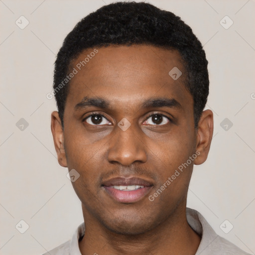 Joyful black young-adult male with short  black hair and brown eyes