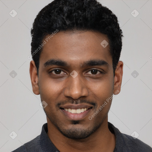 Joyful black young-adult male with short  black hair and brown eyes