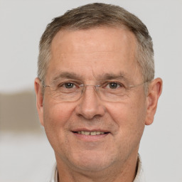 Joyful white middle-aged male with short  brown hair and brown eyes