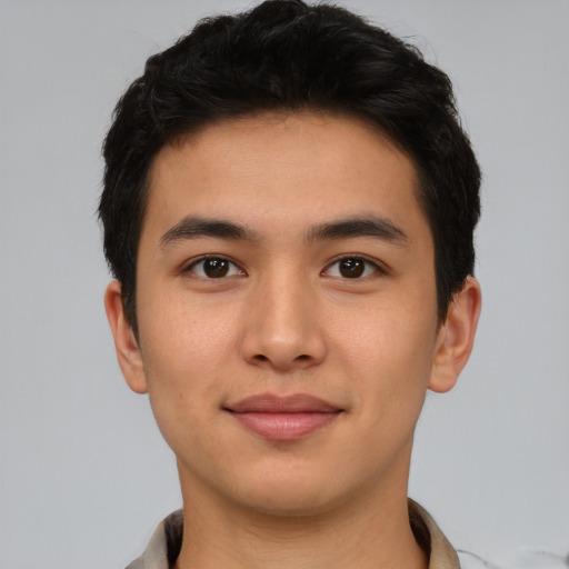 Joyful asian young-adult male with short  black hair and brown eyes