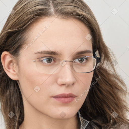 Neutral white young-adult female with long  brown hair and brown eyes