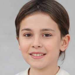 Joyful white child female with short  brown hair and brown eyes