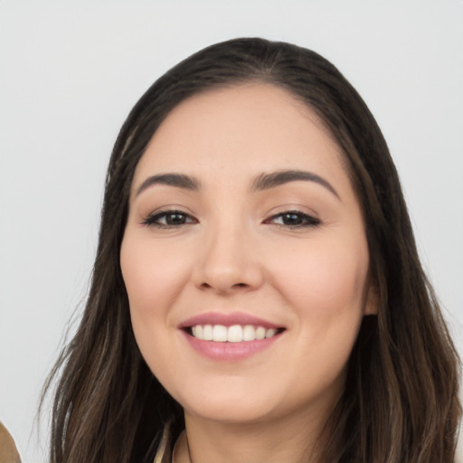 Joyful white young-adult female with long  black hair and brown eyes