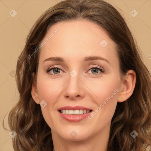 Joyful white young-adult female with long  brown hair and green eyes