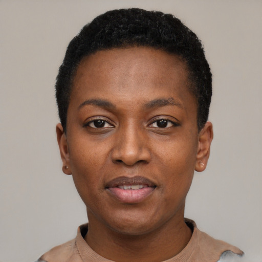 Joyful black young-adult female with short  black hair and brown eyes