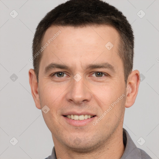 Joyful white young-adult male with short  brown hair and brown eyes