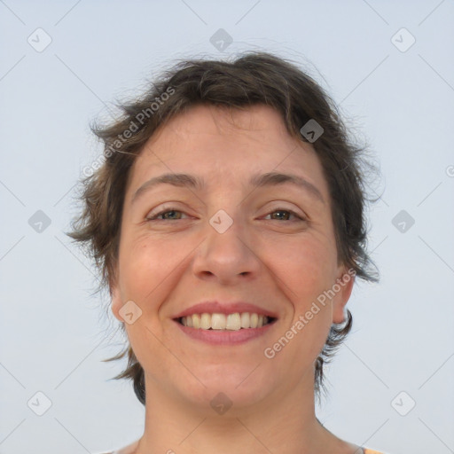 Joyful white adult female with short  brown hair and brown eyes