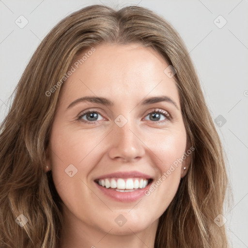 Joyful white young-adult female with long  brown hair and green eyes