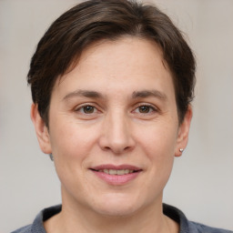 Joyful white adult female with short  brown hair and brown eyes