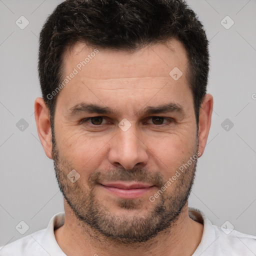 Joyful white adult male with short  brown hair and brown eyes