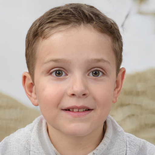 Joyful white child male with short  brown hair and blue eyes