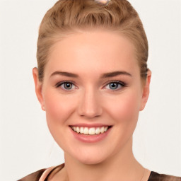 Joyful white young-adult female with short  brown hair and blue eyes