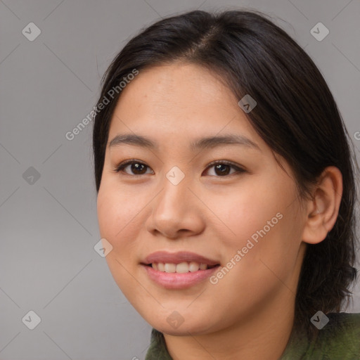 Joyful asian young-adult female with medium  brown hair and brown eyes