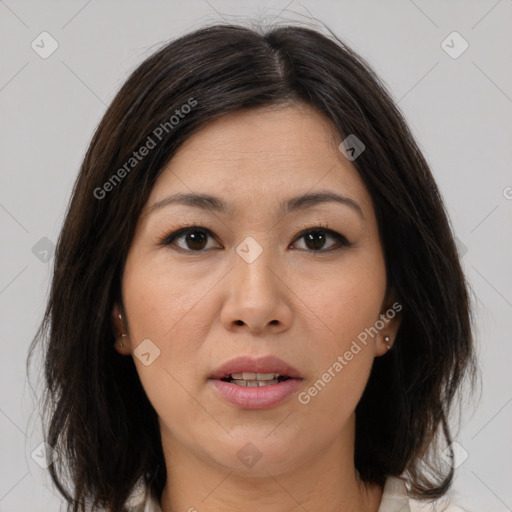 Joyful white adult female with medium  brown hair and brown eyes