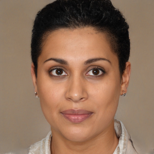 Joyful latino young-adult female with short  brown hair and brown eyes