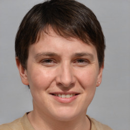 Joyful white adult male with short  brown hair and grey eyes