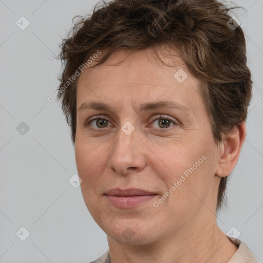 Joyful white adult female with short  brown hair and brown eyes