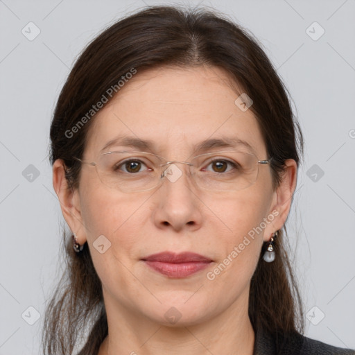 Joyful white adult female with medium  brown hair and grey eyes