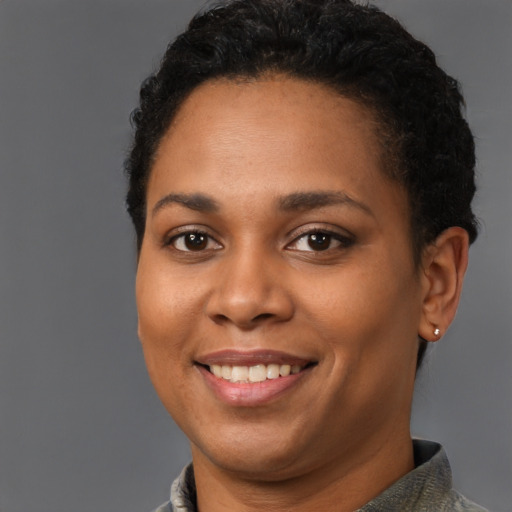 Joyful latino young-adult female with short  brown hair and brown eyes