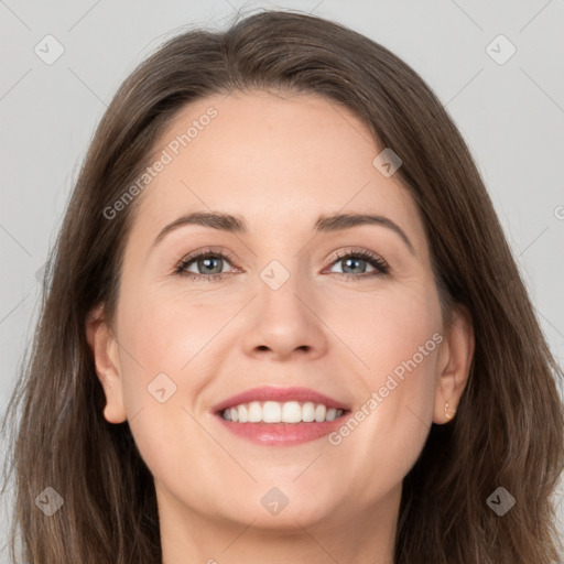 Joyful white young-adult female with long  brown hair and grey eyes