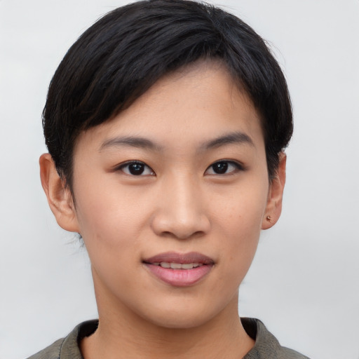 Joyful asian young-adult female with short  black hair and brown eyes