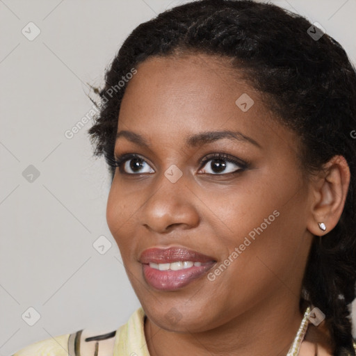 Joyful black young-adult female with short  brown hair and brown eyes