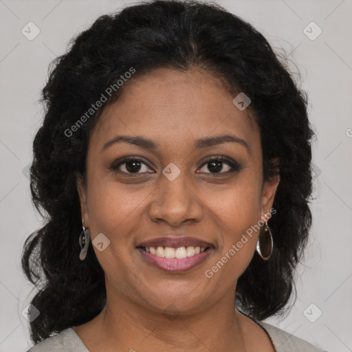 Joyful black young-adult female with medium  brown hair and brown eyes