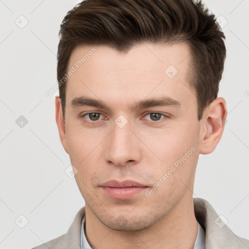 Neutral white young-adult male with short  brown hair and brown eyes