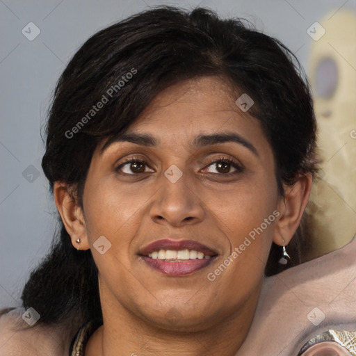 Joyful white adult female with medium  brown hair and brown eyes