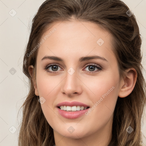 Joyful white young-adult female with long  brown hair and green eyes