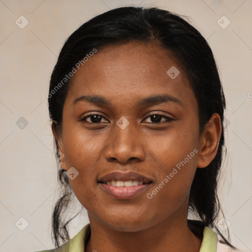 Joyful black young-adult female with medium  brown hair and brown eyes