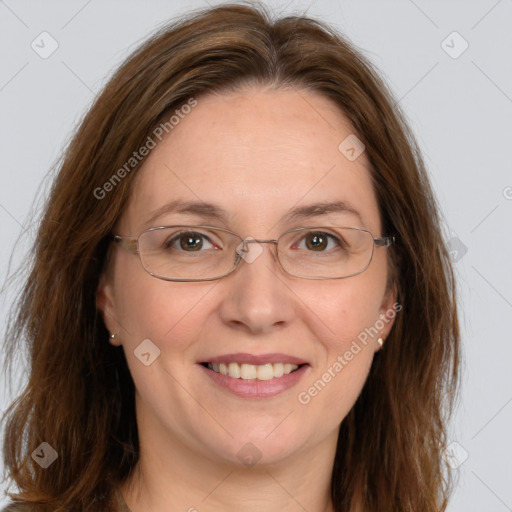 Joyful white adult female with long  brown hair and brown eyes