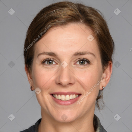 Joyful white adult female with medium  brown hair and grey eyes