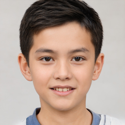 Joyful white child male with short  brown hair and brown eyes