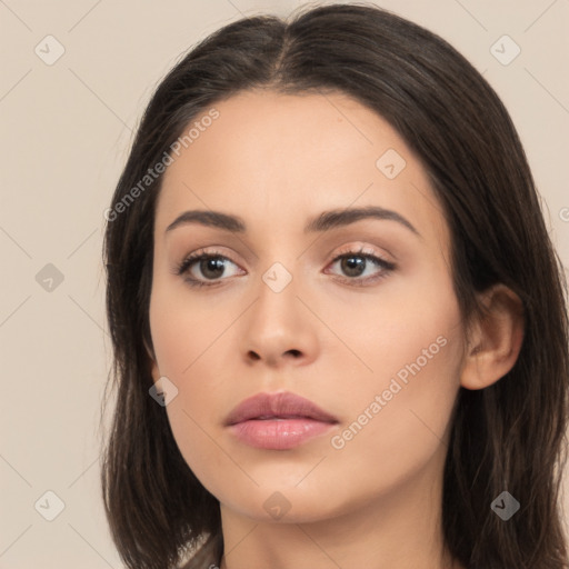 Neutral white young-adult female with long  brown hair and brown eyes