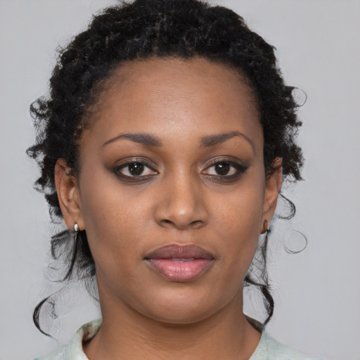 Neutral black young-adult female with medium  black hair and brown eyes