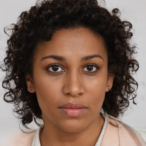 Neutral black young-adult female with long  brown hair and brown eyes