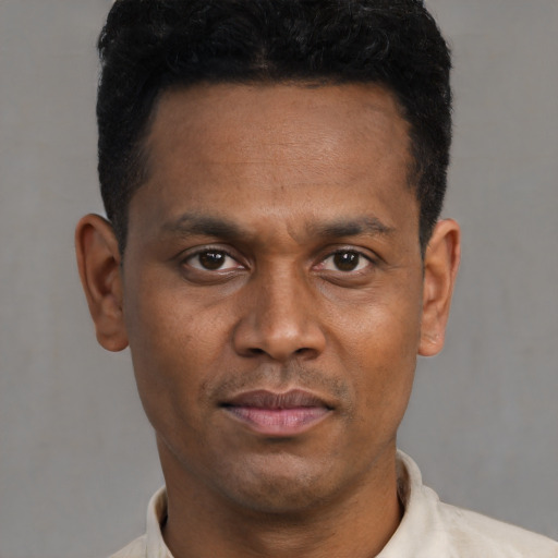 Neutral latino young-adult male with short  brown hair and brown eyes
