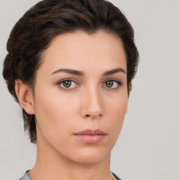 Neutral white young-adult female with short  brown hair and brown eyes