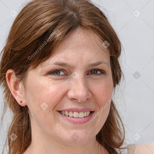 Joyful white adult female with medium  brown hair and grey eyes