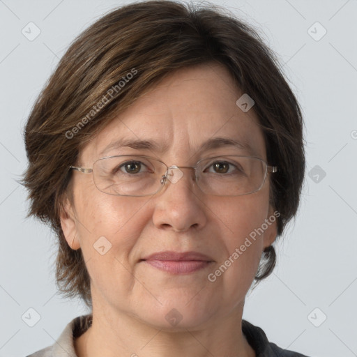 Joyful white adult female with medium  brown hair and grey eyes